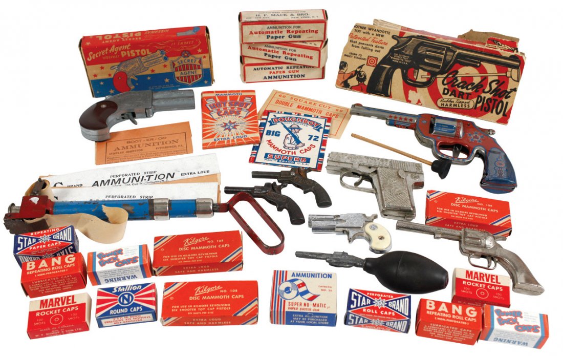 Toy cap guns & ammunition (23): Hubley Pal, Nichols: Toy cap guns & ammunition (23): Hubley Pal, Nichols Dyna-Mite, 2 cast iron single shots: Pluck & Cowboy; tin litho Wyandotte dart pistol w/orig box, Hamilton Secret Agent w/orig box, Langson cap toy &