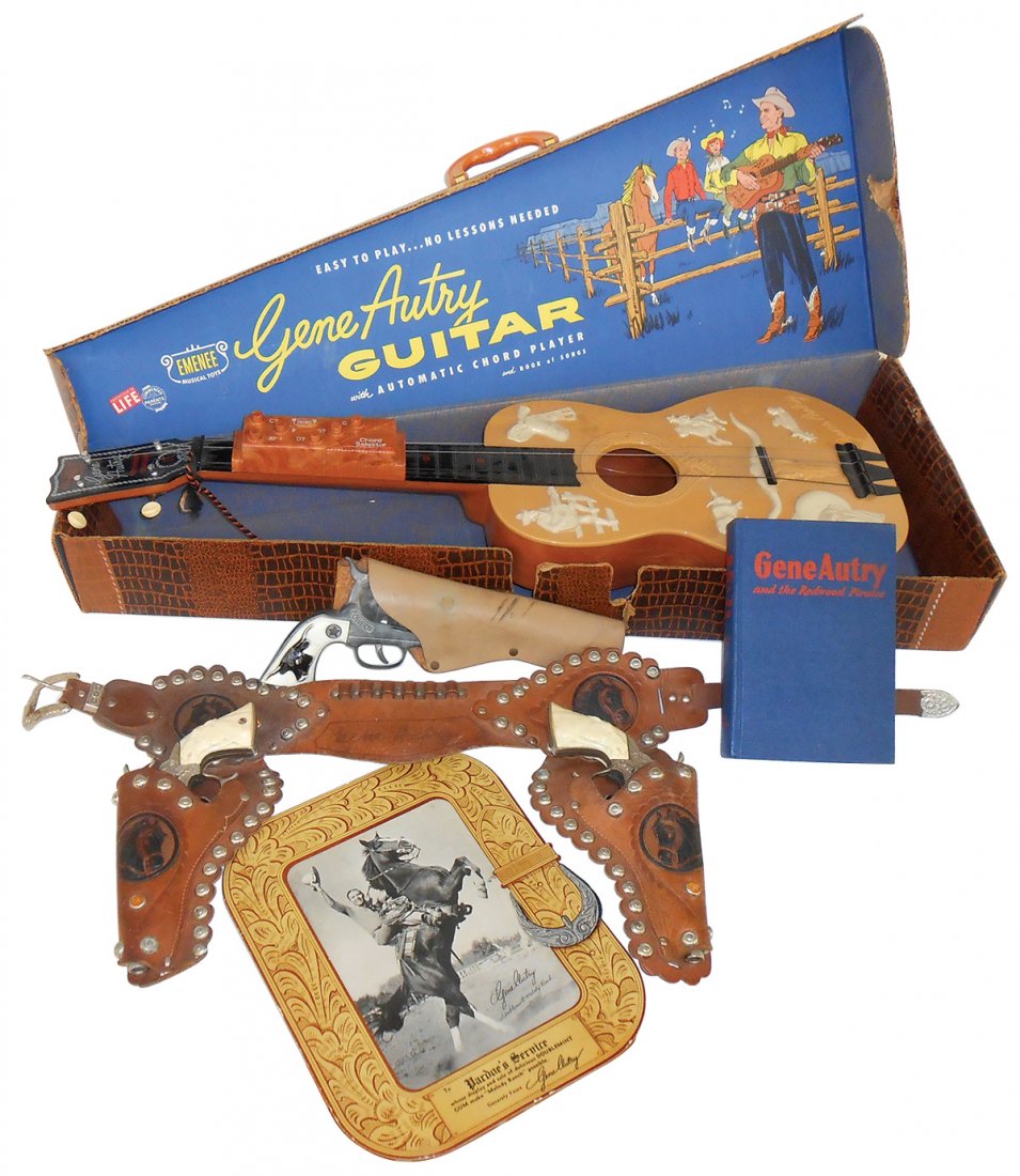 Western toys (5), Gene Autry plastic guitar in orig box;: Western toys (5), Gene Autry plastic guitar in orig box; Gene Autry leather double holster set w/Gene Autry pistols; cdbd photo display for Doublemint Melody Ranch; "Gene Autry and the Redwood Pirates