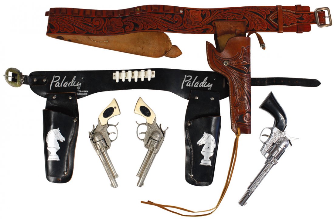 Western toys & books (6), leather single holster set: Western toys & books (6), leather single holster set w/Hubley gun w/black handles & deeply tooled leather, Paladin double holster set w/matching pistols, Halco The Texan spurs in orig box, 3 books: "R