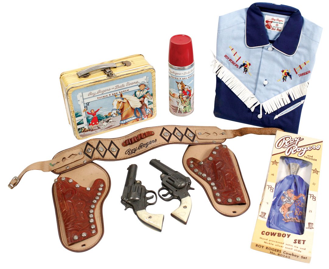 Western Roy Rogers items (5), Roy Rogers & Dale Evans: Western Roy Rogers items (5), Roy Rogers & Dale Evans lunch box, new-old-stock Roy Rogers cowboy shirt, scarf & neck slide in orig box & Roy Rogers leather double holster set w/2 Bang-O cast metal pis