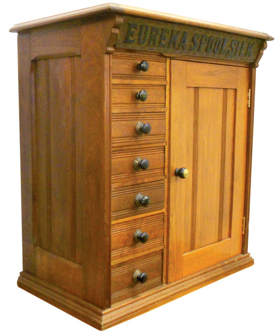 Country store spool cabinet, Eureka Spool Silk, walnut: Country store spool cabinet, Eureka Spool Silk, walnut 7-drwr w/side door, interior shelves & paneled sides, missing back plates on 2 knobs, o/wise Exc cond, 27"H x 24"W x 13.5"D.