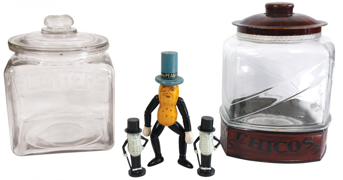 Country store peanut items (4), Planters Peanut glass: Country store peanut items (4), Planters Peanut glass jar w/peanut knob on lid, Planters Peanut plastic S&P set, Mr. Peanut jointed wood figure (Exc cond) & Chico glass jar w/metal lid, Good/VG cond u