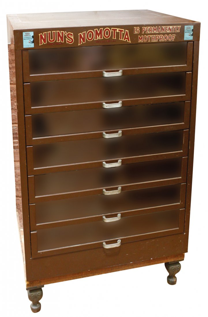Furniture, Nun's Nomotta metal storage cabinet on base: Furniture, Nun's Nomotta metal storage cabinet on base w/iron feet, mfgd by T. Buettner & Co., c.1932, orig brown paint & adv decals, 7 drwrs w/glass fronts, Exc cond w/light use, 47"H x 28.5"W x 22.5
