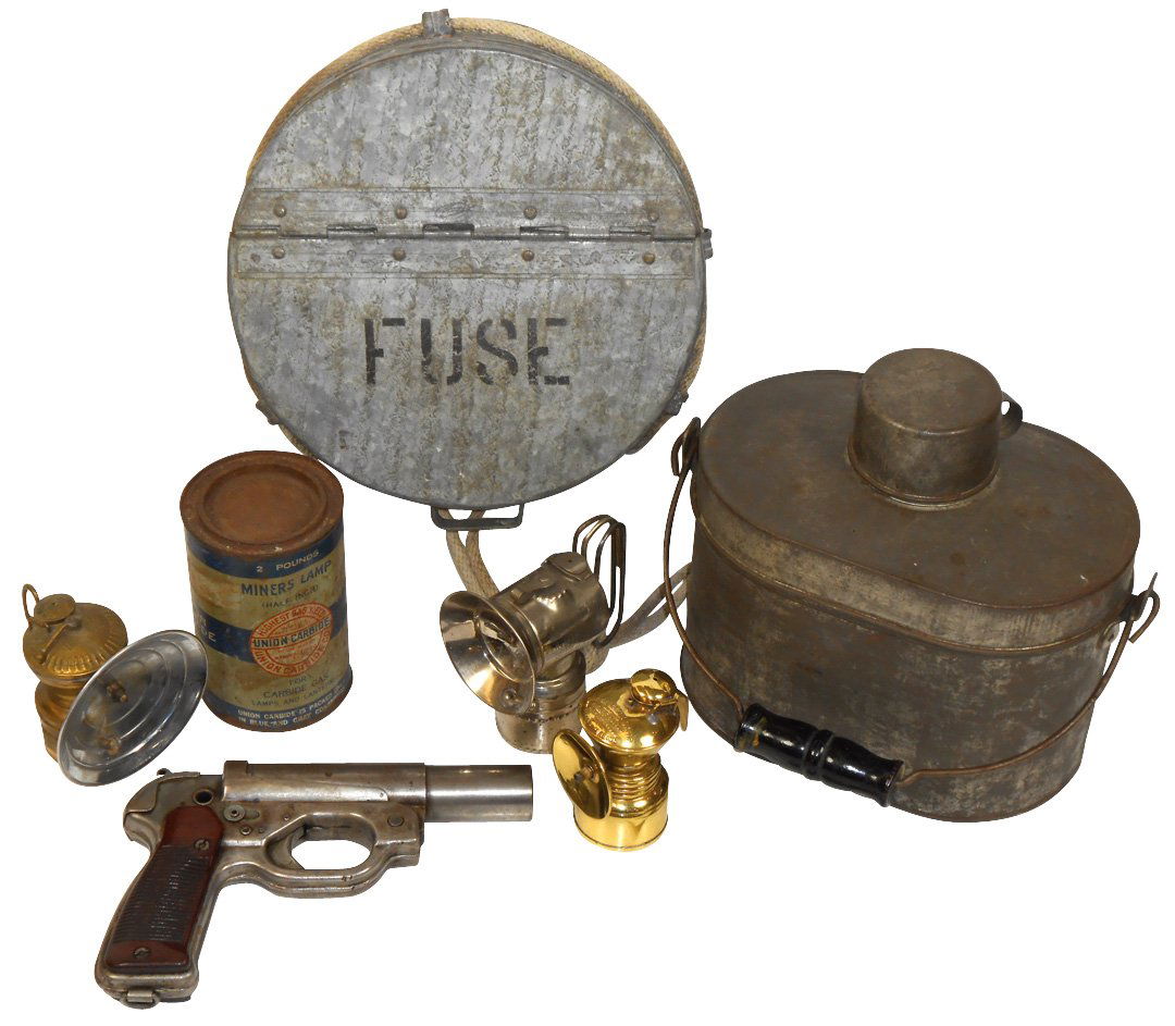Miner's items (7), flare gun marked wa137362 w/Bakelite: Miner's items (7), flare gun marked wa137362 w/Bakelite grips, tin lunch bucket w/cup, 3 miner's lamps, round galvanized fuse box w/rope handle & Union Carbide tin (Fair), all VG & Exc cond unless not