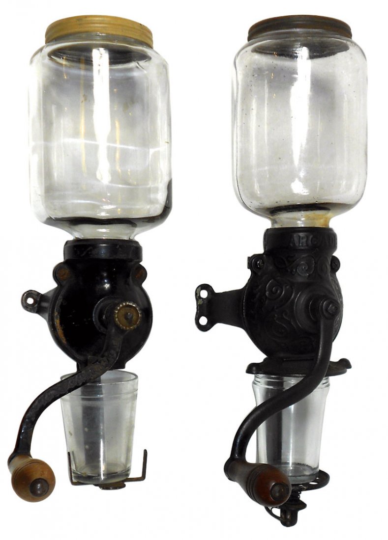 Coffee grinders (2), Arcade Crystal No. 1 w/embossed: Coffee grinders (2), Arcade Crystal No. 1 w/embossed lid & catch cup, Exc cond, 18"H x 4.5"Dia & unmarked Arcade w/plain lid & catch cup, VG+ cond, 15.5"H x 4.5"W.