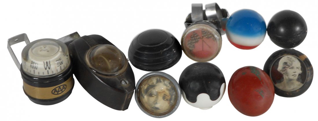 Automotive compasses, steering wheel & shifter knobs: Automotive compasses, steering wheel & shifter knobs (10), metal, plastic & rubber shifter knobs, 2 w/ladies on faces, some w/out inserts; steering wheel knob w/checkered flag on face & 2 compasses, o