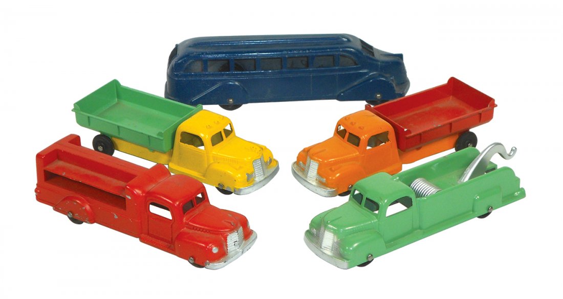 Toy vehicles (5), (4) Tootsietoys, includes 2 dump: Toy vehicles (5), (4) Tootsietoys, includes 2 dump trucks, delivery truck & wrecker & (1) Metal Masters bus, all metal w/orig paint in Exc cond, 6 -7.25"L.
