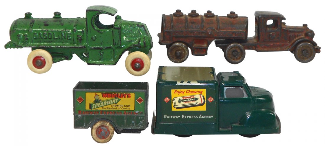 Toy trucks (3), Arcade Gasoline truck (new tires), 5"L: Toy trucks (3), Arcade Gasoline truck (new tires), 5"L & Gasoline Motor Oil 2-pc truck, 5.5"L, both cast iron & Wrigley's Railway Express Agency truck w/trailer (trailer has broken tongue), plastic & 