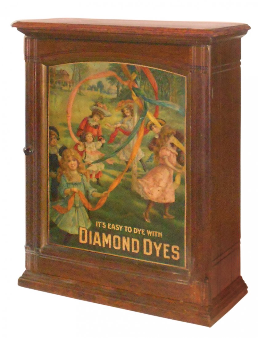Country store Diamond Dyes cabinet, Maypole, wood: Country store Diamond Dyes cabinet, Maypole, wood w/embossed tin litho door insert & sliding back doors, VG+ cond w/minor loss on insert, 30"H x 23"W x 10"D.