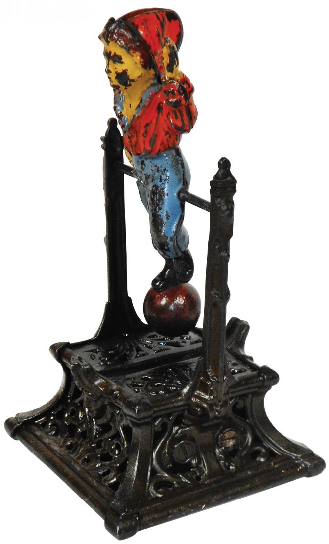 Mechanical bank, Boy on Trapeze, cast iron w/orig: Mechanical bank, Boy on Trapeze, cast iron w/orig paint, c.1888, mfgd by J. Barton Smith Co.-Philadelphia, PA, VG+ cond w/some paint loss on boy, 9"H.