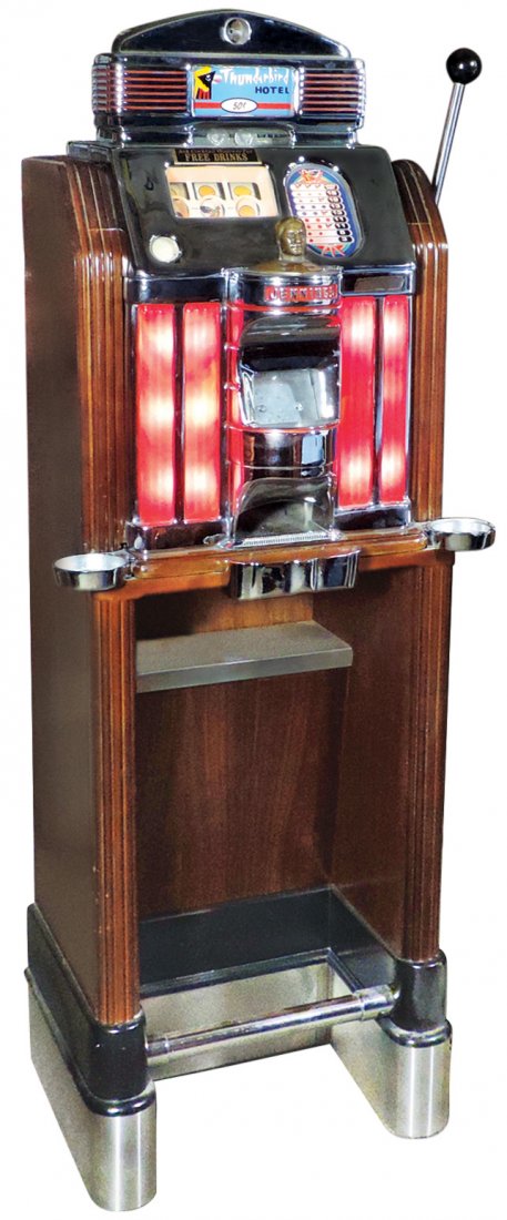 Coin-operated slot machine, Jennings Club Chief in: Coin-operated slot machine, Jennings Club Chief in standing wood floor cabinet w/ashtrays, glove shelf & footrest, a 50 Cent mechanical light-up orig to the Thunderbird Hotel, c.1950's, beautifully re