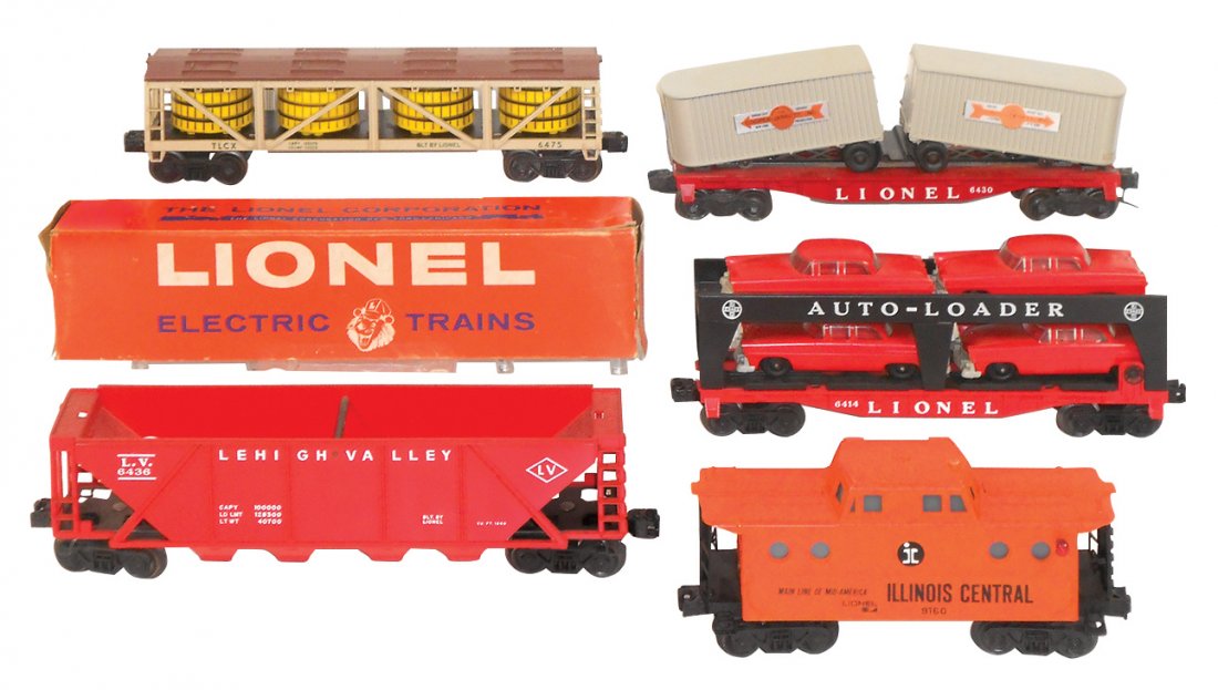 Model train cars (5), Lionel O gauge, 6430: Model train cars (5), Lionel O gauge, 6430 Cooper-Jarrett flat w/semi trailers, Good, 11"L; Lionel 6414 auto loader Evans w/cars, VG+, 11"L; 9160 Illinois Central caboose, VG+, 8.5"L; 6436 Lehigh Vall