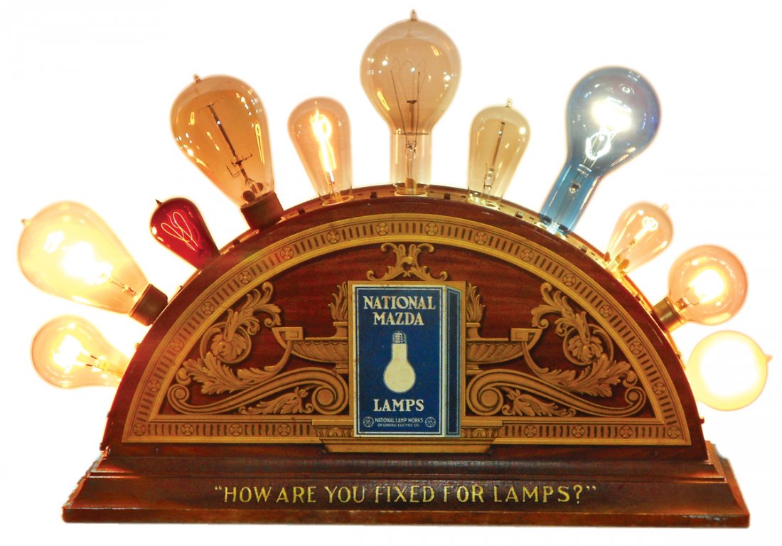 Advertising counter display, National Mazda Lamps,: Advertising counter display, National Mazda Lamps, National Lamp Works of General Electric Co., 2-sided litho on metal w/wood base, a great display in VG+ working cond, 20"H x 27.5"W x 6"D.