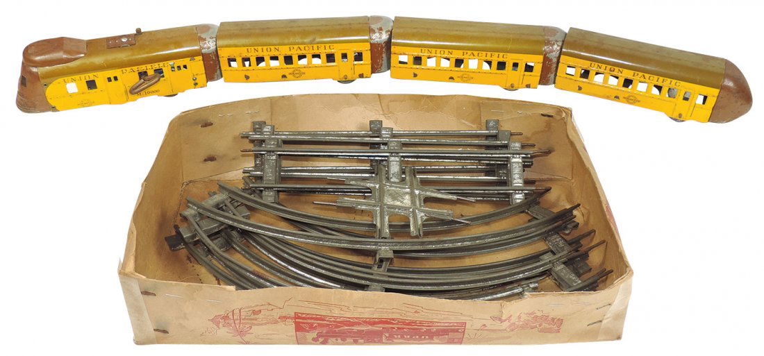 Model train cars (4), Hafner windup set, M10000 Union: Model train cars (4), Hafner windup set, M10000 Union Pacific, O gauge, incl track, Good/VG cond w/some paint loss on bumper ends, ea car approx 7"L.