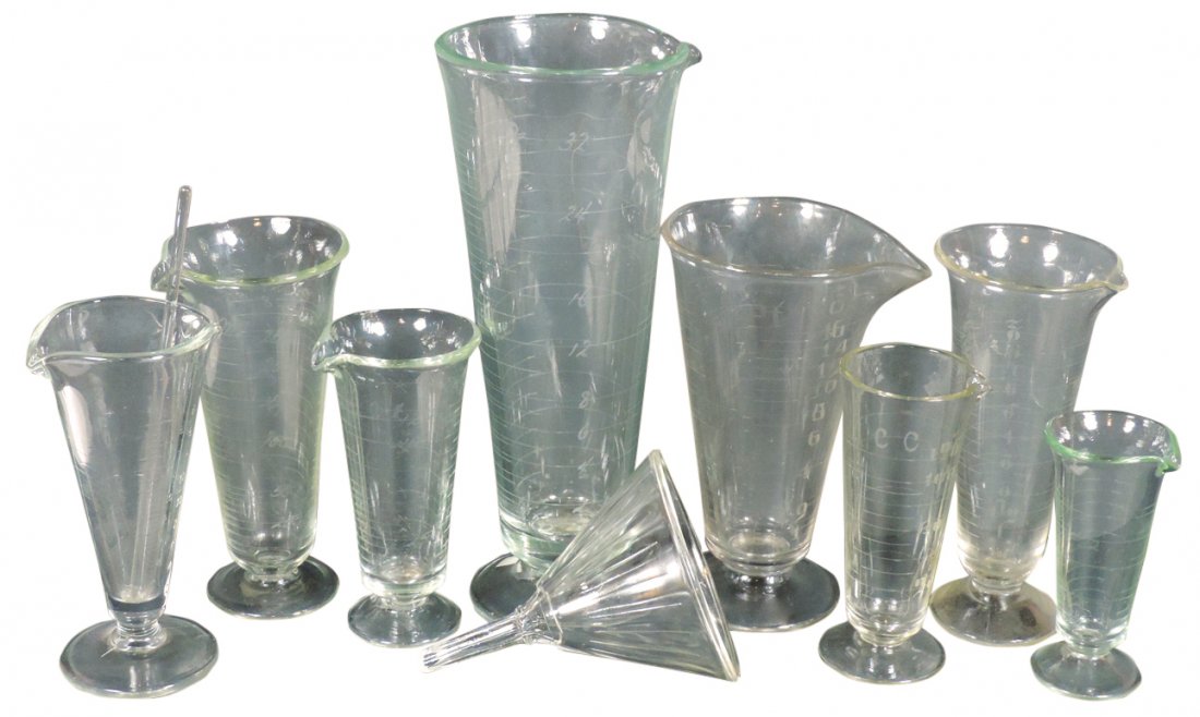 Drug store apothecary graduates & funnel (9), etched: Drug store apothecary graduates & funnel (9), etched glass (7), 2-16 oz & embossed w/pour spout both sides, plus funnel & mix stick, Exc cond, graduates are 5.25"-12"H.