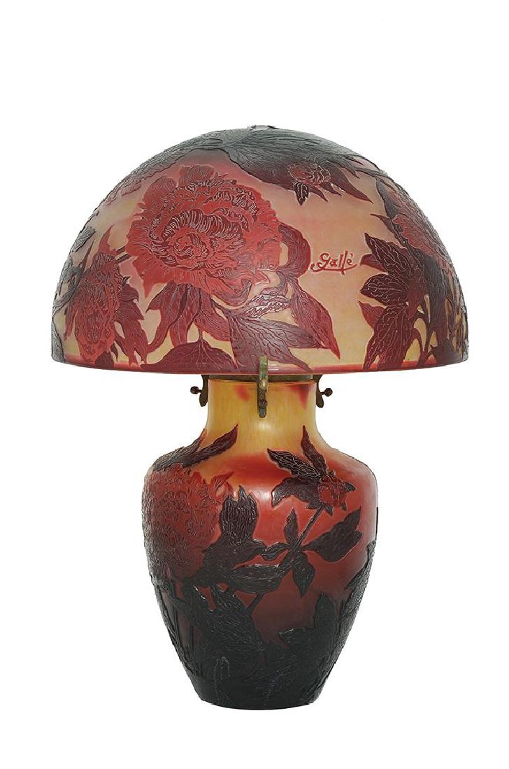 A CAMEO GLASS SIDE TABLE LAMP: Decorated with red chrysanthemums in cameo on etched yellow ground cameo mark ’Galle’ 49 cm high 19th century Overlaid in ruby red and yellow and etched with monuments within roundels 13/17 cm hig