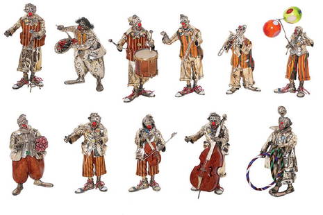 A SET OF ELEVEN ITALIAN SILVER CLOWN MUSICIANS: Late 20th century, Ancini Humorously modelled, mounted with Murano glass, wood and ceramic, enameled faces and details Stamped ANCINI 16-20 cm Provenance: Eisenberg Collection