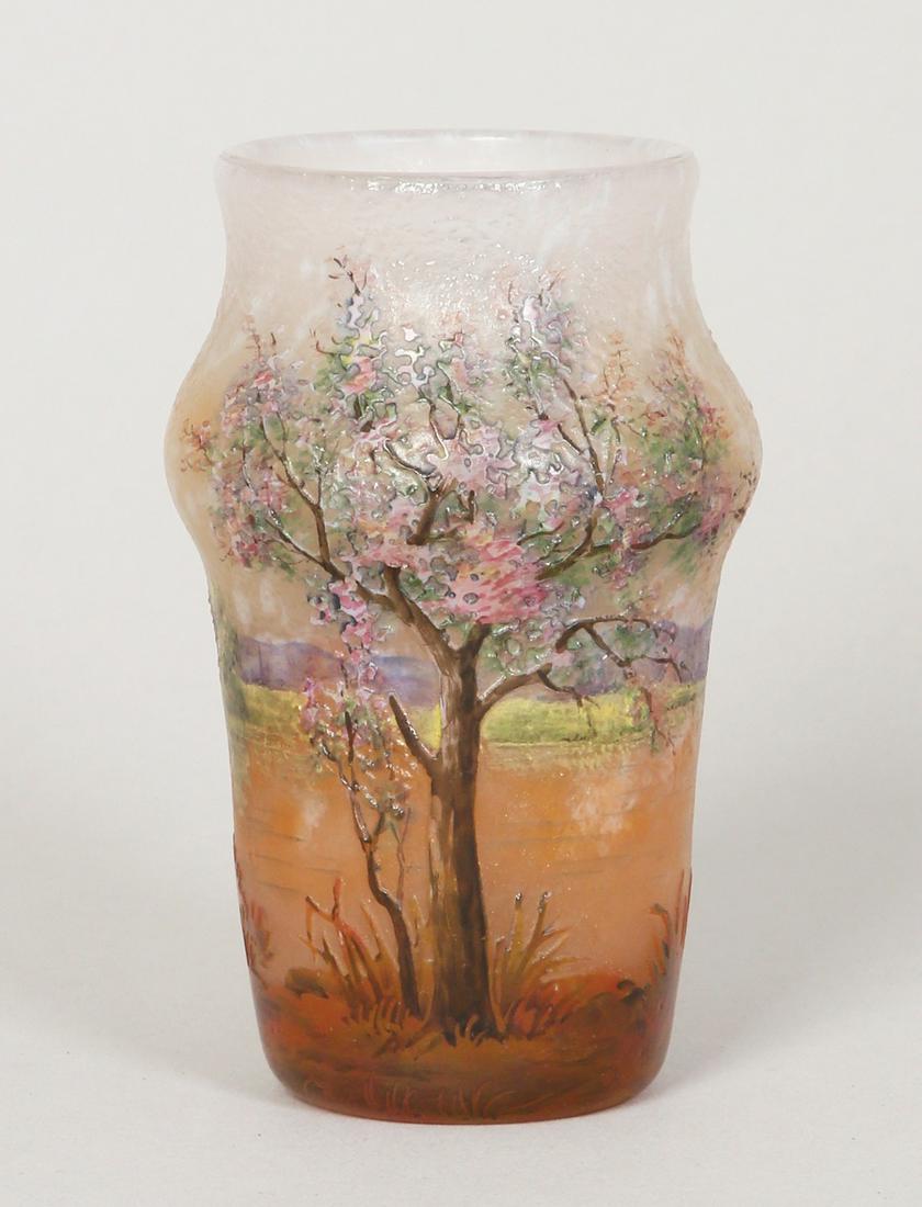 A DAUM NANCY CAMEO AND ENAMEL MINIATURE GLASS VASE: France, c. 1900. Decorated in cameo and enamel in the form of a lake with beautiful trees. Enamel mark 'Daum Nancy' and cross of Lorraine. 10.5 cm high. Provenance: Estate of Shaul Eisenberg.