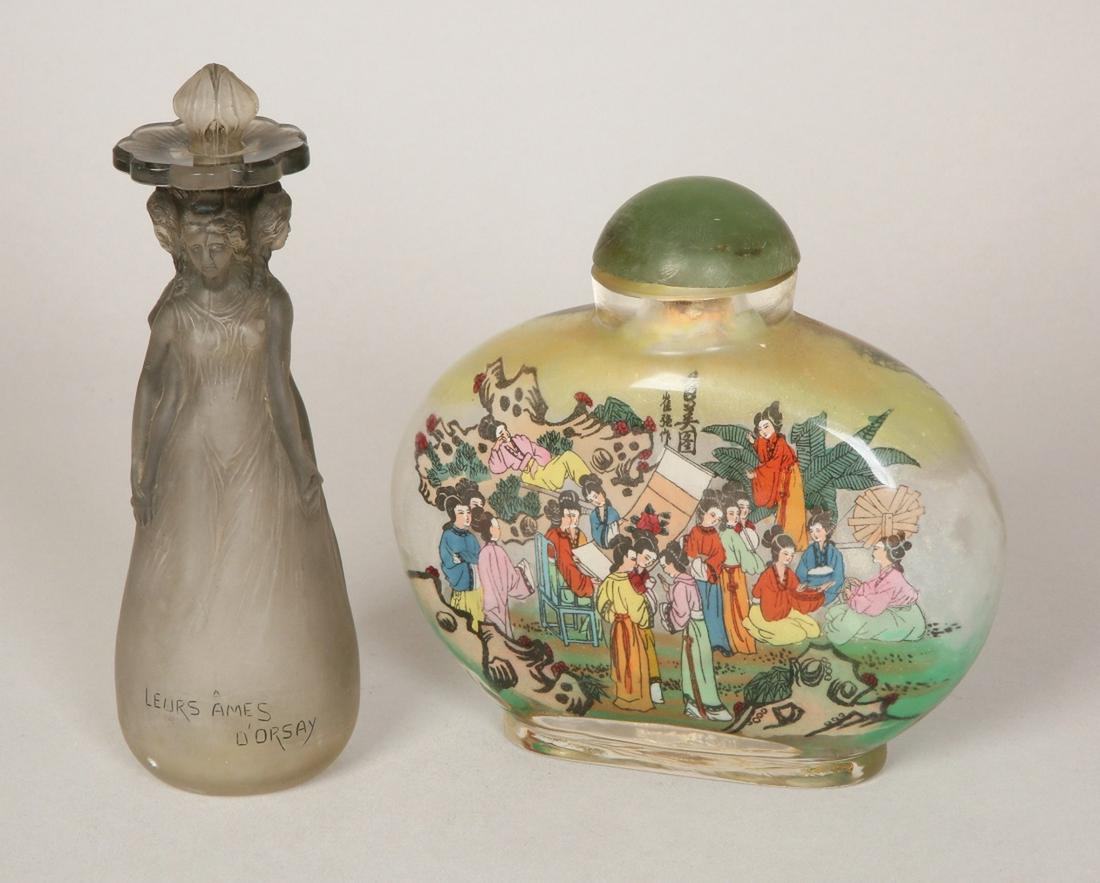 A LOT OF TWO GLASS BOTTLES: Comprising: A. Likely France, c. 1970. Modeled in the form of women. Etch mark Leurs Ames D'Orsay. B. Snuff, China, 20th Century. Decorated with figures of women. Jade stopper. 14/17 cm high.Provenanc