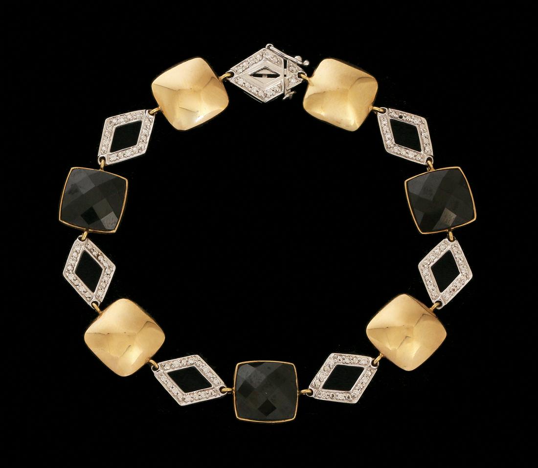 A 18K WHITE AND YELLOWE GOLD BRACELET (1 of 2)