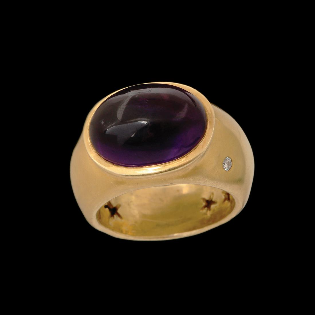 A PAIR OF 18K H.STERN GOLD RING: Set with a small diamond and an amethyst in a cabochon polish. Size approx. 9 US. Weight approx, 17 gm.