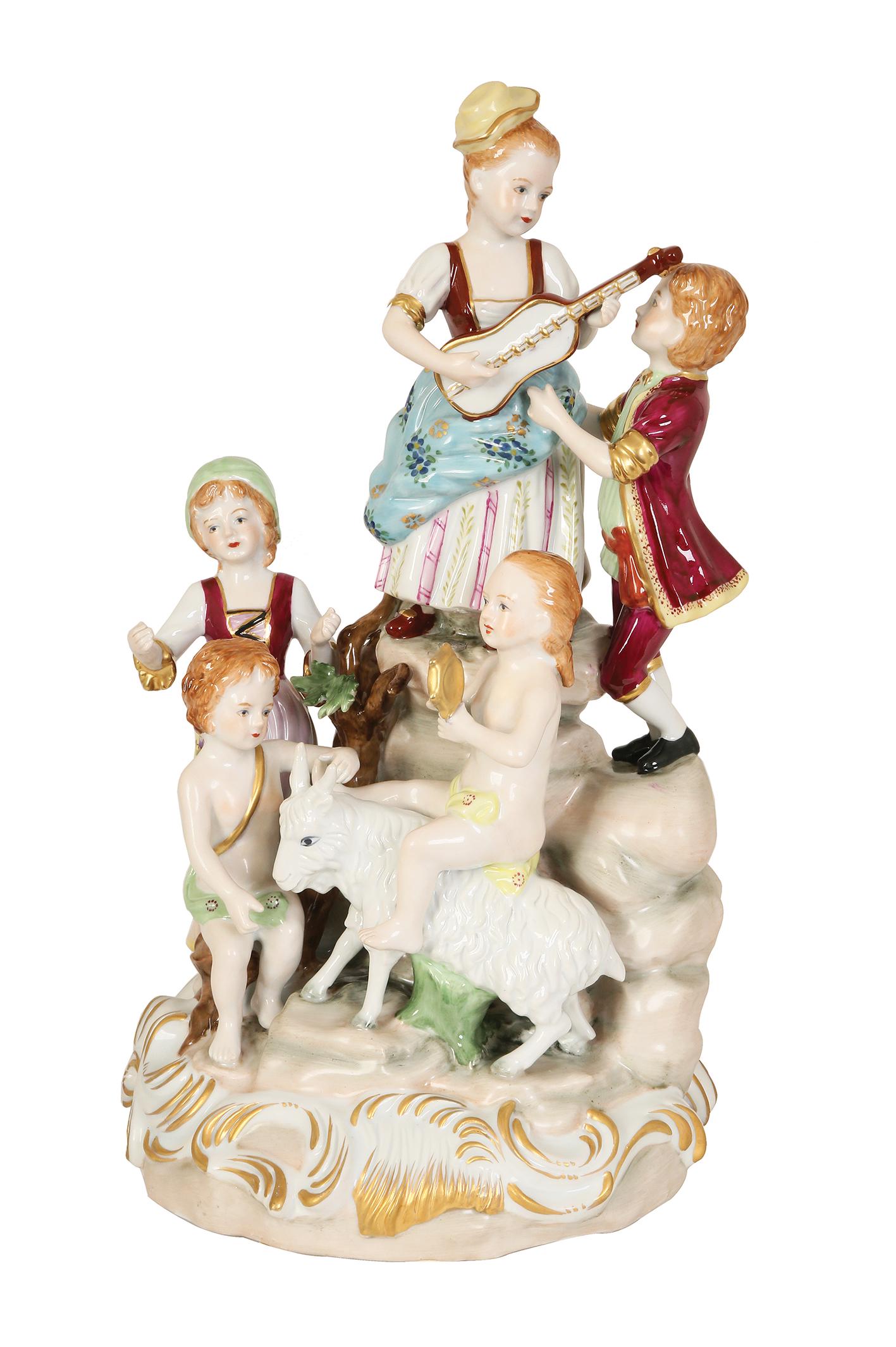 A LARGE PORCELAIN GROUP FIGURE OF CHILDREN AND PUTTI PLAYING INSTRUMENTS (1 of 1)