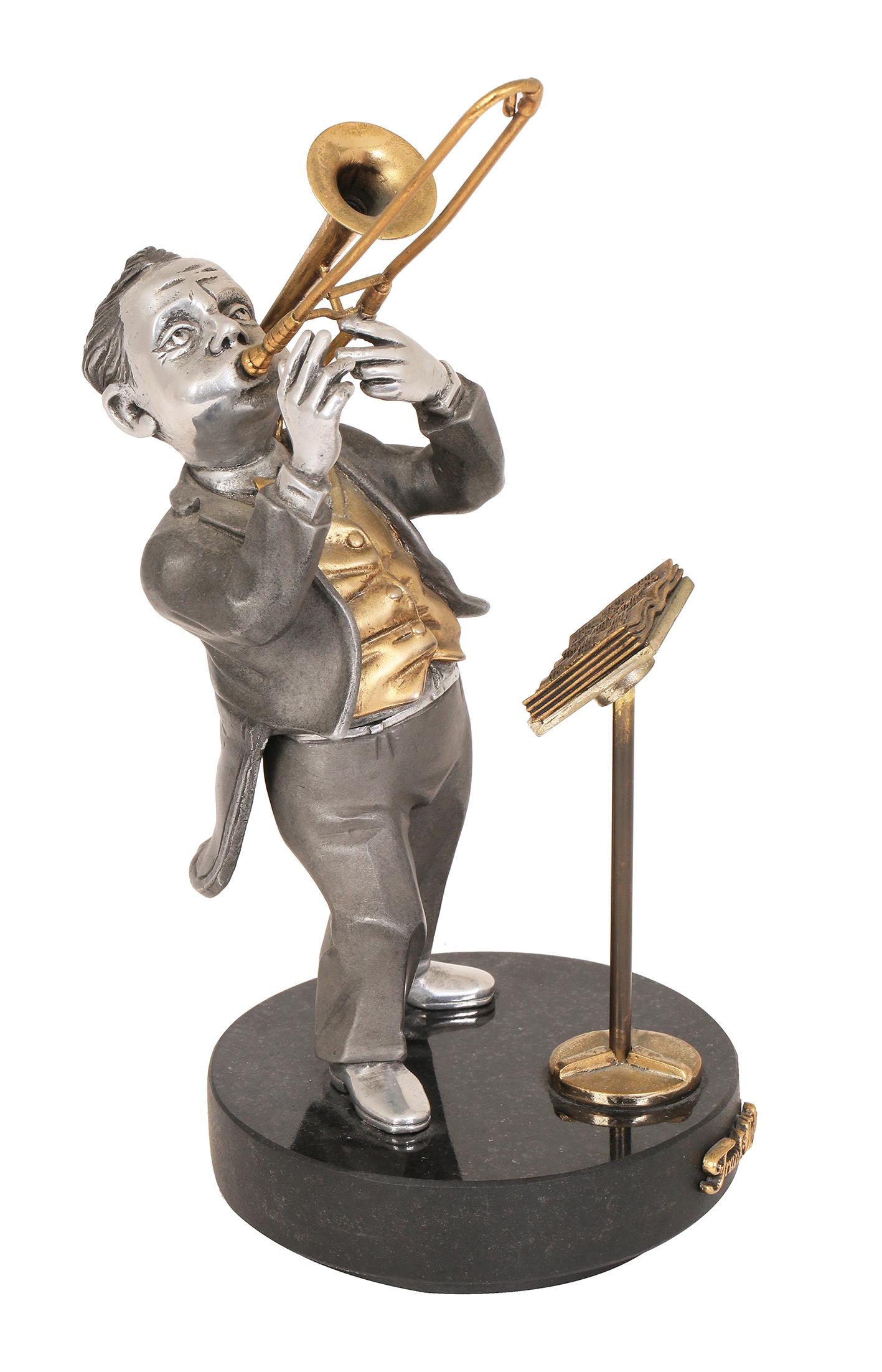 A FRANK MEISLER GILT AND SILVER PLATED METAL SCULPTURE OF THE PHILHARMONIC TROMBONIST (1 of 1)