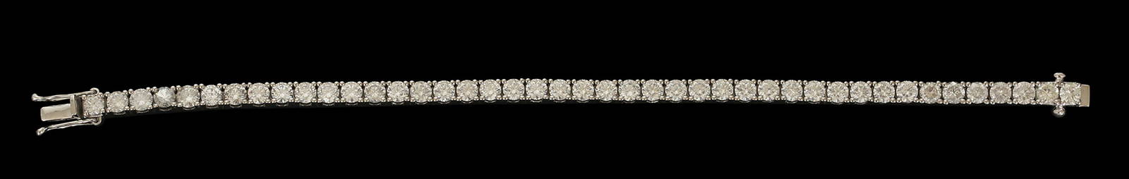 A 14K WHITE GOLD TENNIS BRACELET