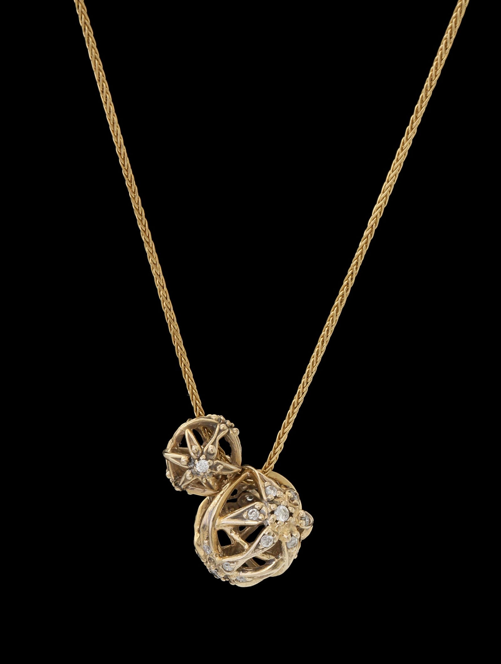 H.STERN 18K GOLD PENDANT: In a design with two graduated balls set with small diamonds. Includes an 18K gold necklace.