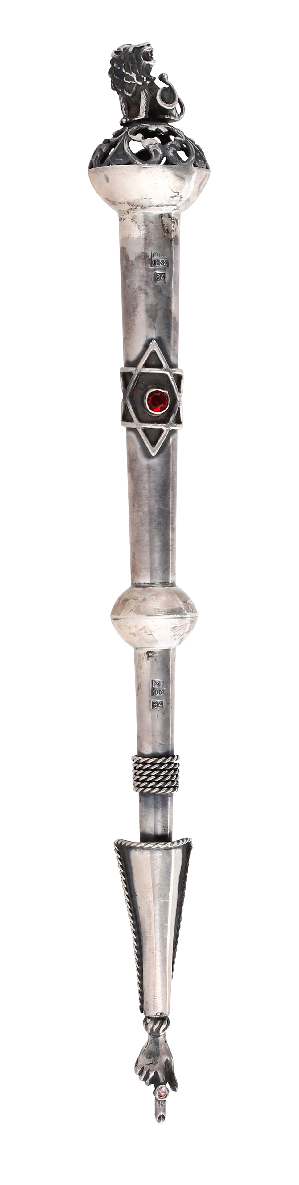 ANTIQUE RUSSIAN SILVER TORAH POINTER: Decorated with spherical sections, Stars of David, a ring set with red gemstones, twisted braids, and an applied lion atop a Rocaille-style “cage” at the tip. Maker’s mark: Mikail