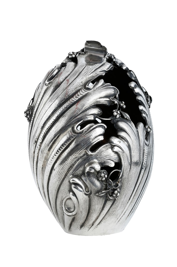 AN ITALIAN SILVER VASE: Milan, 1944–1968. Italian Neo-Rococo style, decorated with repousse work of swirling acanthus leaves and flowers. Signed. Weight: approx. 1,497.7 grams. Height: 35 cm.