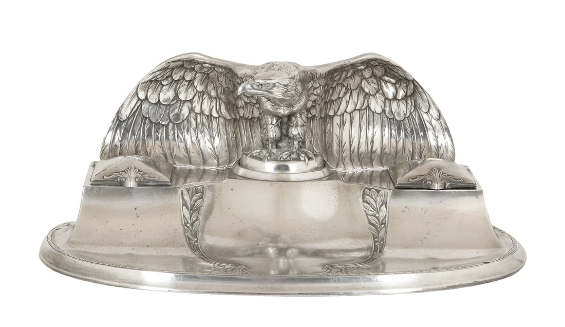WMF. GERMAN SILVER-PLATED INKSTAND: 1925–1935. Two ink wells. Decorated with a sculptural figure of an eagle and acanthus leaves . From a special export series. Signed. Width: 35 cm.