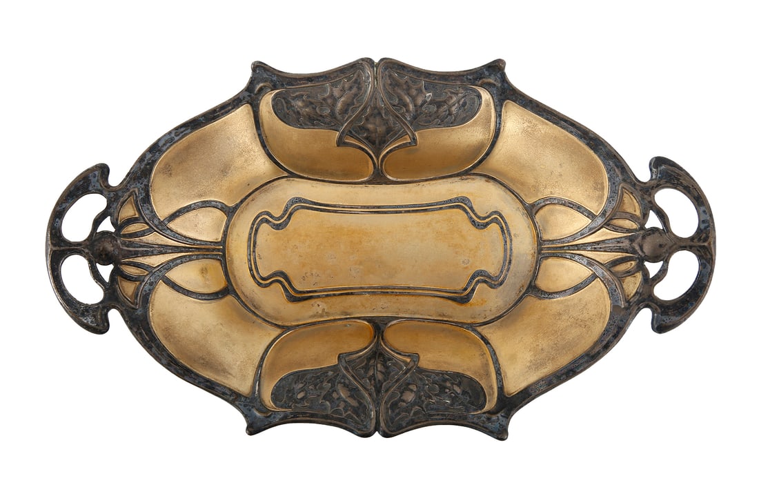 WMF. GERMAN SILVER-PLATED BOWL: Art nouveau, 1886–1903. Decorated with whiplash lines and oak leaves. Gilt interior. Signed. Length: 31 cm.