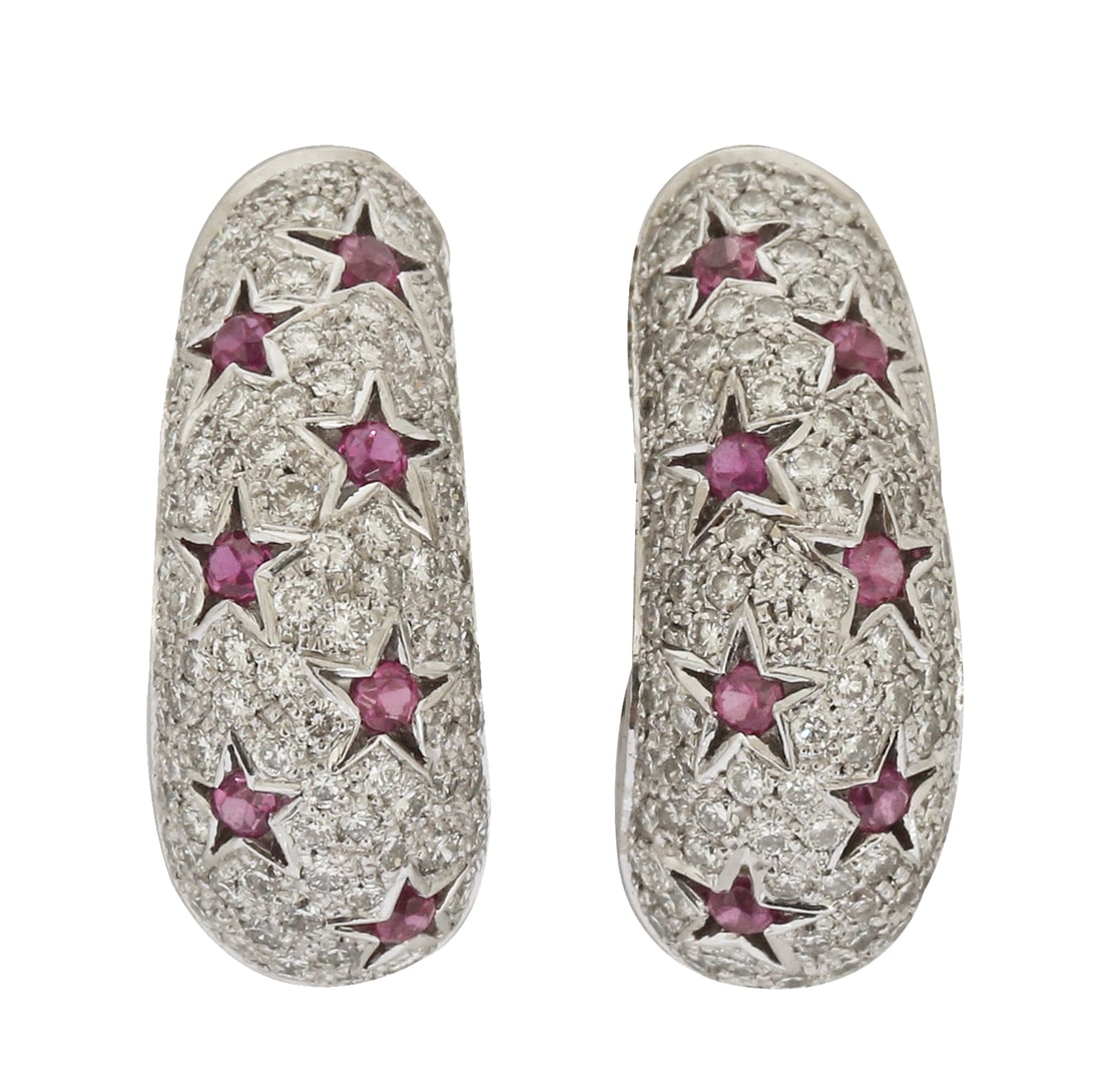 18K WHITE GOLD EARRINGS: Studs, set with diamonds and elements in a star design set with rubies.