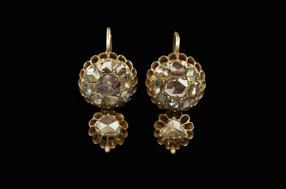 A PAIR OF 14K ROSE GOLD EARRINGS: Russian, antique. Composed of a large rosette set with a central old cut diamond and diamonds around, bearing a small rosette set with a central old cut diamond.