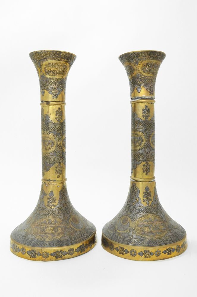 A PAIR OF MASSIVE SILVER AND COPPER INLAID BRASS: Syria, early 20th century Inlaid with arabesques, mashrabiya and Hebrew 43 cm high Provenance: Gaby and Ami Brown Collection