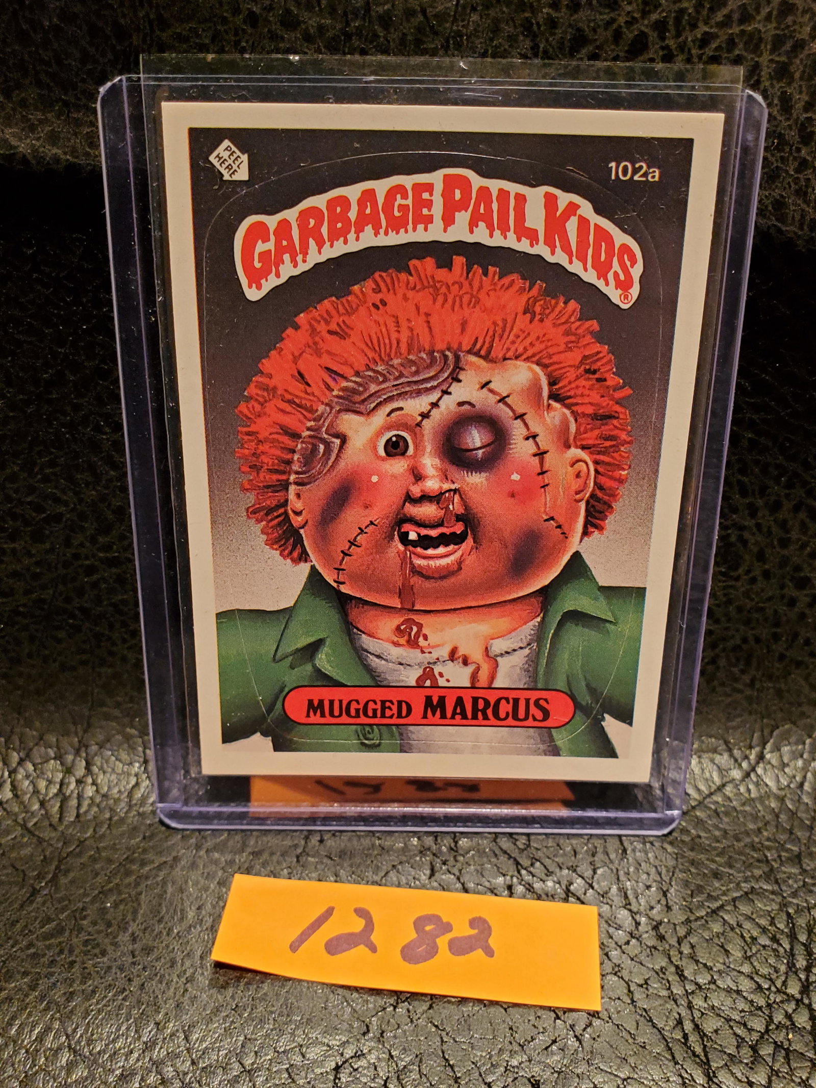 Mugged Marcus 1986 Topps Garbage Pail Kids Series 3 Stickers #102a: Mugged Marcus 1986 Topps Garbage Pail Kids Series 3 Stickers #102a