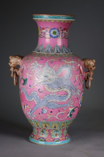 QianLong Mark, A Chinese Famille Rose Vase Bottle: Qing Period and Qian Long mark, the famille rose bottle vase decorated with delicate two five-claws dragons in different form on each side of the vase, and vivid flowers linked by green branches shown