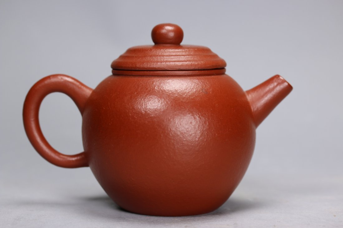 A Yixing Teapot by Meng Chen: the Yixing teapot inscribed to the base with a poetic verse reading Ming Yue Song Jian Zhao (Bright moon spray its light across pine woods). from a poem written by the Tang dynasty poet Wang Wei, foll