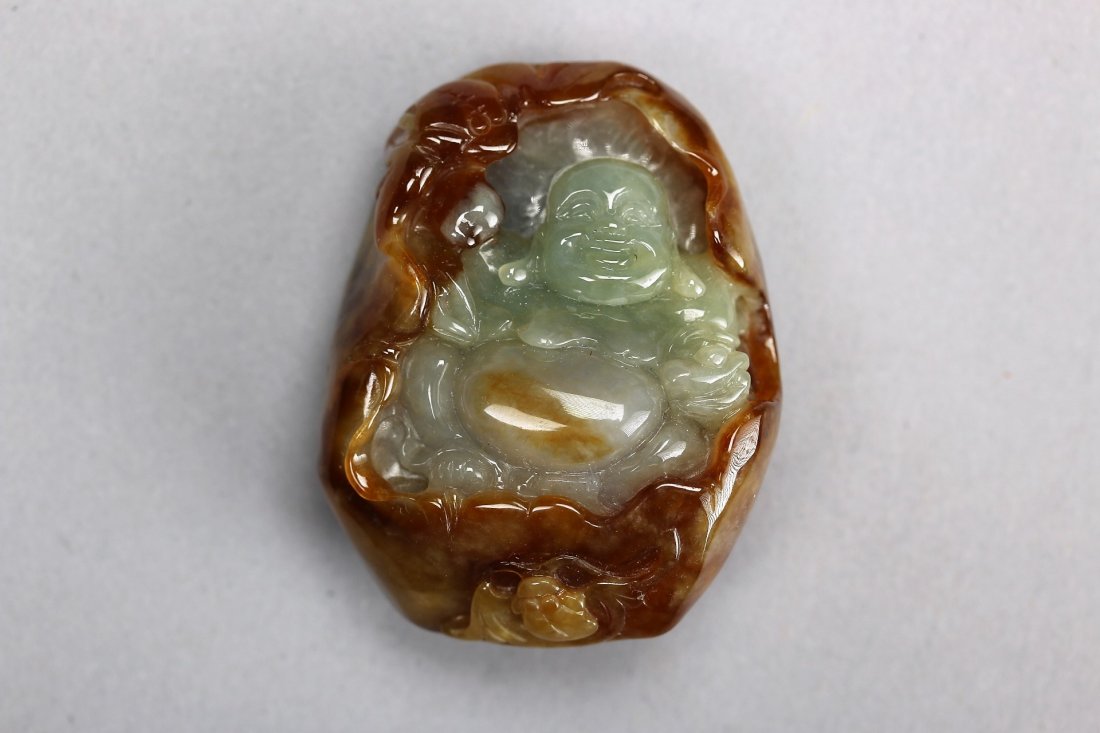 A Russet and Green Jade Figure of Buddha (1 of 4)