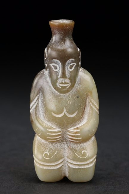 A Chinese grey-white jade figure: A Chinese grey-white jade figure.Possibly Warring states period. Provenance: Bonhams auction.H:2 1/2 In.