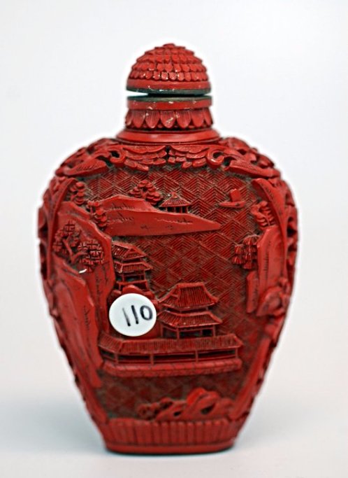 A Chinese carved cinnabar lacquer snuff bottle (1 of 3)