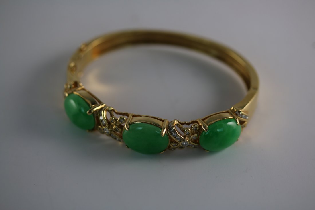 A fine 18K Y/G jadeite diamond bangle bracelet (1 of 2)