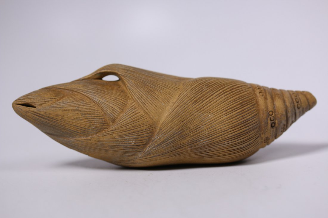 An Yixing water dropper, Chen Mingyuan: 陈铭远，紫砂水滴.Signed Chen Mingyuan, late Qing/Republic period.Molded from clay of buff yellowish hue, the thickly potted vessel rendered in the shape