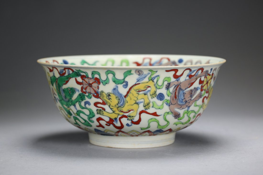 A Chinese Doucai "Lions" Porcelain Bowl: Ming Dynasty, Cheng Hua Mark.大明成化年制斗彩狮子戏球碗.Diam:7 1/8".