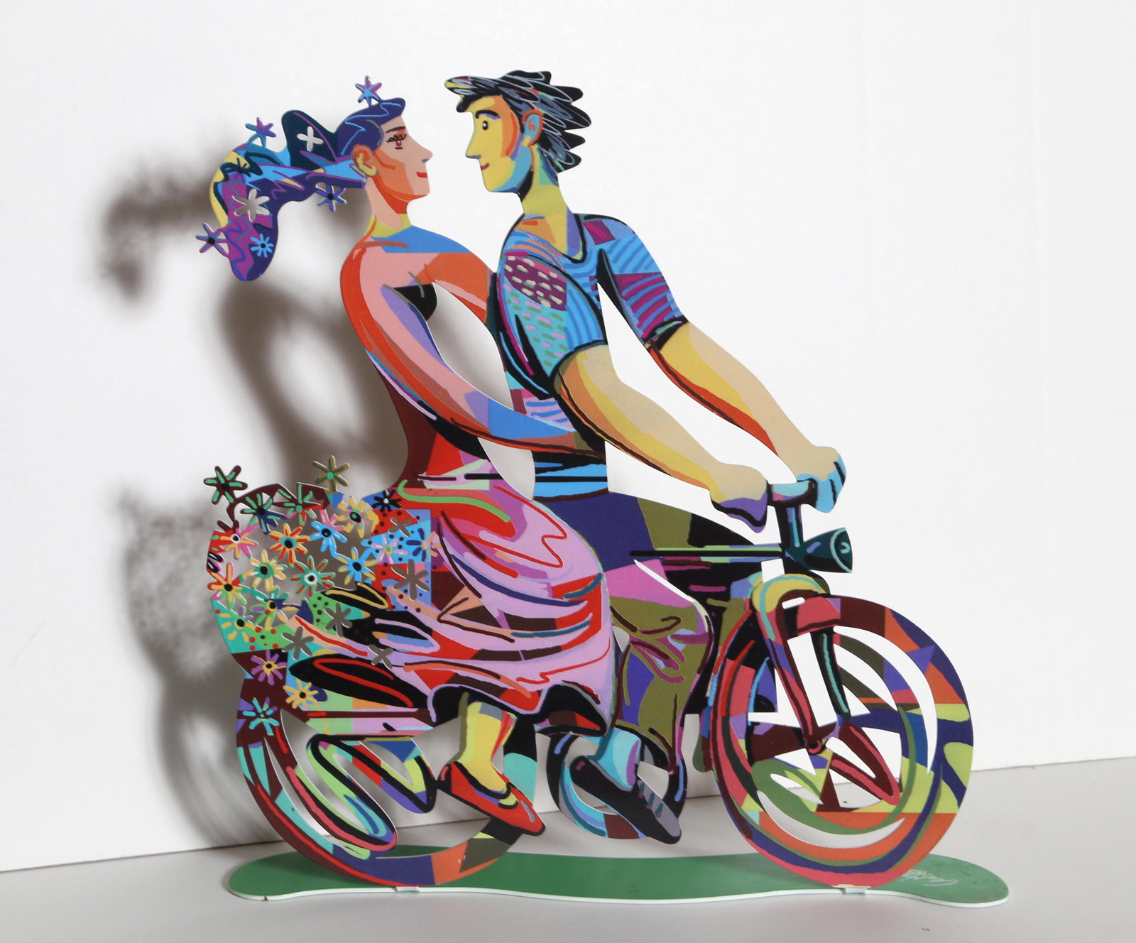David Gerstein, Spring Riders, Enameled Metal Sculpture: Artist: David Gerstein, Israeli (1944 - ) Title: Spring Riders Medium: Enameled Metal Sculpture, printed signature on base Size: 14 x 13 x 2.5 in. (35.56 x 33.02 x 6.35 cm) Description: This bright an