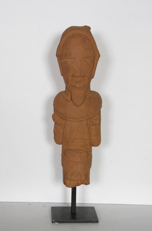 Nok Head Figurine, Nigerian, Terracotta Sculpture: Origin: Nigeria Title: Nok Head Figurine (Nigeria) Year: 500 BC - 200 AD Medium: Terracotta Sculpture Size: 21 in. x 6 in. x 5 in. (53.34 cm x 15.24 cm x 12.7 cm) Frame Size: Total Height with Stand: