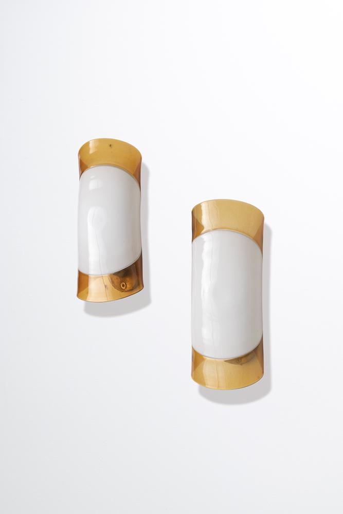GIANMARIA POTENZA: Coppia di lampade da parete. Metallo nichelato, vetro lavorato a caldo. Produzione La Murrina anni '70. cm 23x10x10 A PAIR OF WALL LIGHTS BY G. POTENZA Condizioni generali buone. Piccoli graffi, lievi