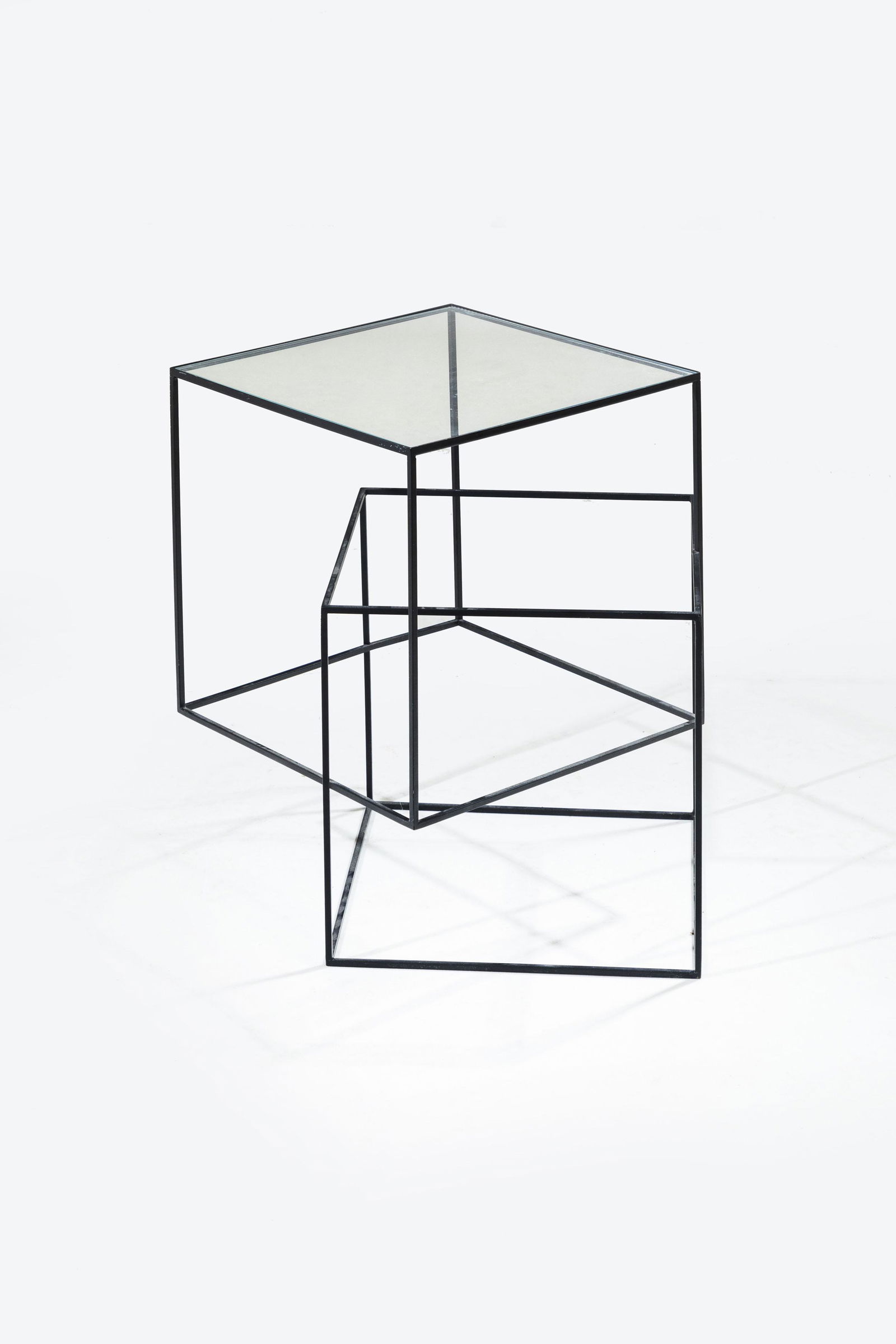 NENDO: Tavolino mod. Thin Black. Metallo verniciato, cristallo molato. Produzione Cappellini XXI secolo. cm 51x49x49 A LOW TABLE BY NENDO Catalogo di produzione Cappellini. Condizioni molto buone. Leggeri se