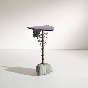 TONI CORDERO: Tavolino da centro. Pietra, metallo brunito, smalto, bronzo. Esecuzione del Campo, 1990 ca. Pezzo unico. Firma incisa sotto il piano: T.C./90 Del Campo cm 80x50x48 AN OCCASIONAL TABLE BY T. CORDERO Bu